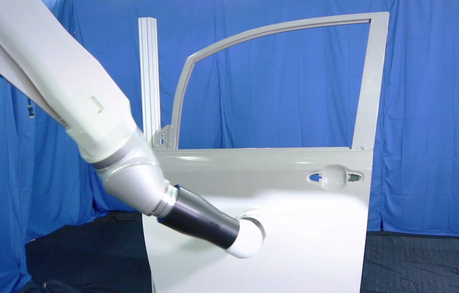 painting automotive door panel with new TKS i-ESTA paint applicator