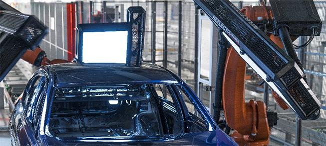 Automotive car body with robotic automated defect detection system